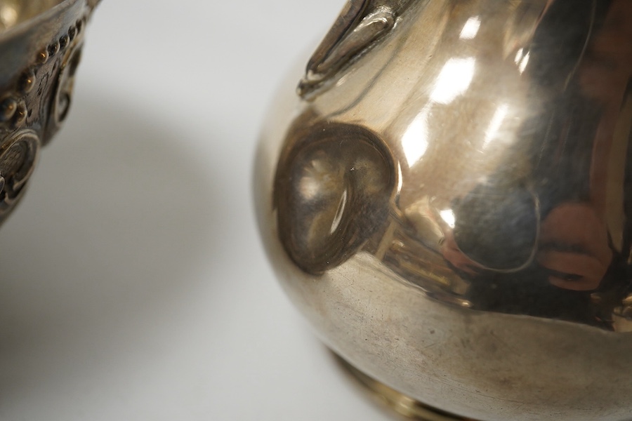 A small French white metal hot water pot, 13cm, a continental white metal bowl (a.f.) and a 19th century German white metal spoon. Condition - poor to fair